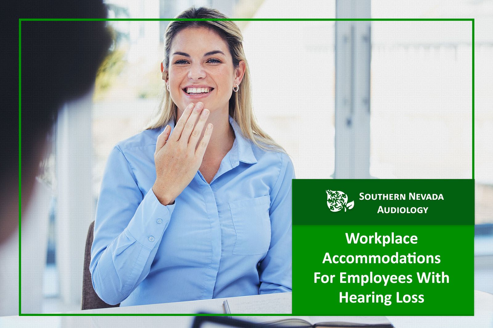 hearing impaired employee with hearing aid using sign language