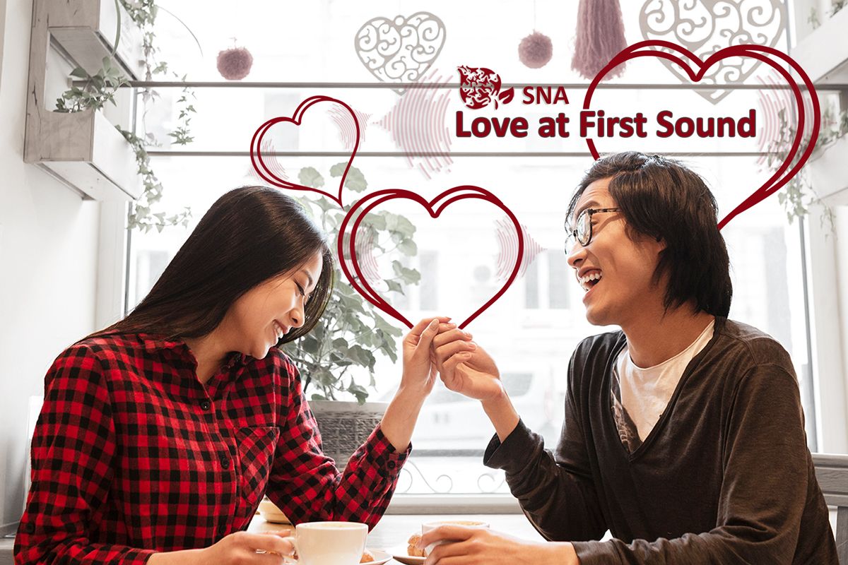 loving couple holding hands at restaurant table.