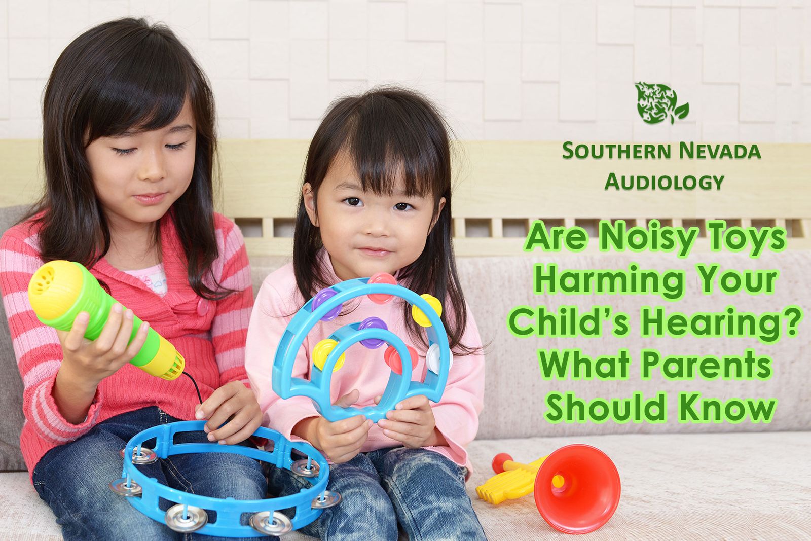 2 little girls playing with musical toys