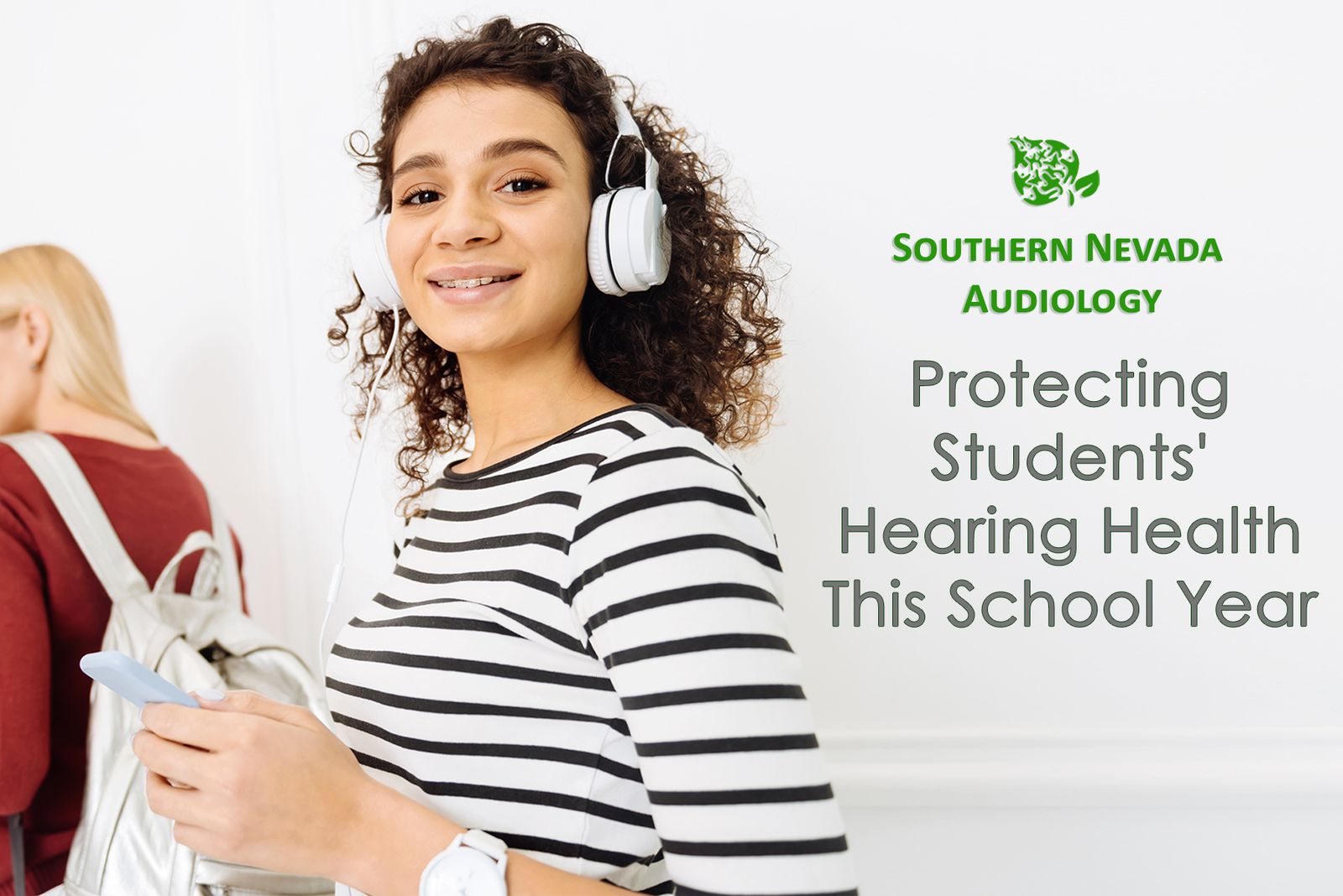 student with head phones to protect her hearing health.