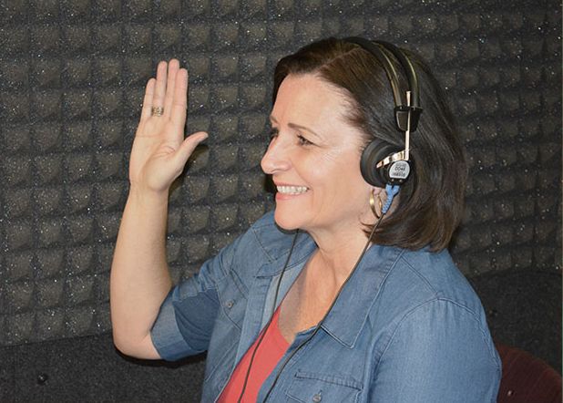 Patient taking a hearing test in the sound-treated booth at our Las Vegas audiology clinic