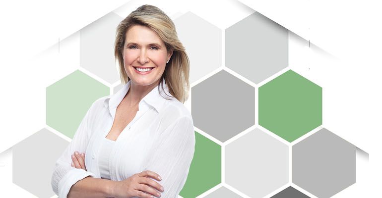 Confident woman in front of a honeycomb pattern, illustrating hearing technology for every lifestyle